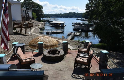 Osage Beach House | 5 Bedroom, 5 Bathroom Tropical Fun! HOT TUB, AQUA PAD, FIRE PIT, and BEACH!