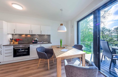 Krakow am See Apartment | 5-star vacation apartment Sonnengruß with a side view of Lake Krakow