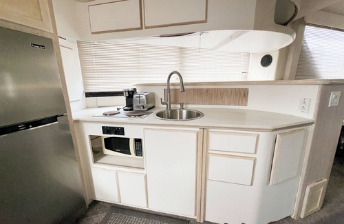 Anchor Bay Harbor Boat Rental | 50ft Stationary House Boat with Upper Sun Deck