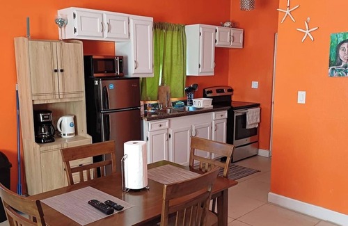 Leeward Settlement Apartment | 55 Oasis Cottage. Studio suite. Nearby World's #1 Grace Bay Beach.