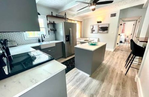 Sun Bay South House | 5805 S Hubert Ave · Charming Tropical Pool Retreat w Hot Tub