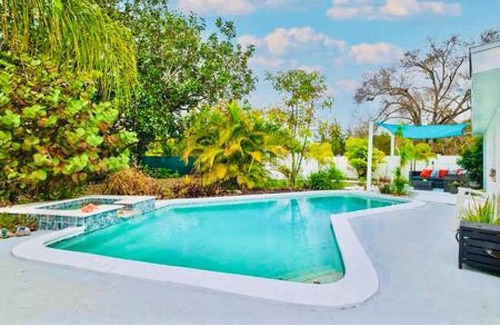 Sun Bay South House | 5805 S Hubert Ave · Charming Tropical Pool Retreat w Hot Tub