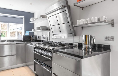 Stoke Ferry House | 7 Storey Listed Windmill, dog friendly with outdoor pool & bbq