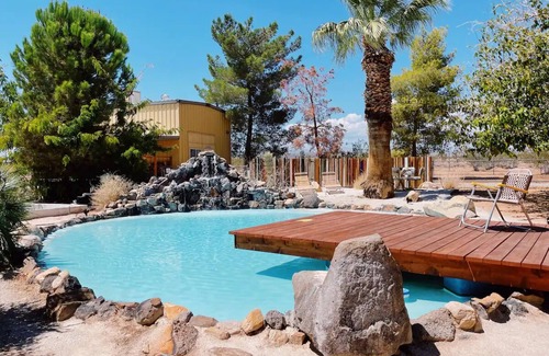 Yucca Valley House | 80s dreamworld with waterfall lagoon, bowling lane, hot tub under the Milky Way