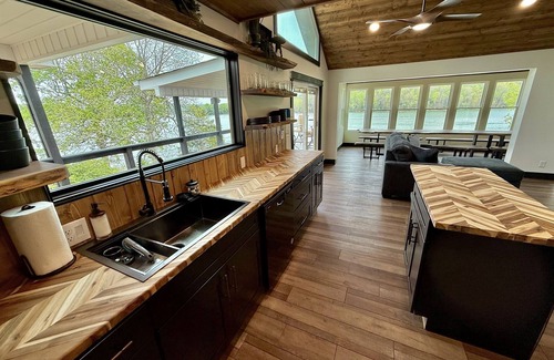 La Follette Cabin | 9 bdrm covered dock, firepit and large bar on water, Baltic hot tub, sleeps 26,