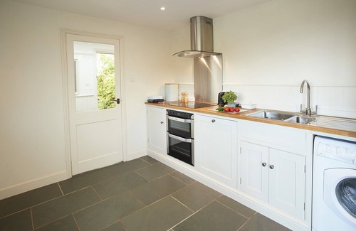 Wittersham Cottage | A charming, detached, weather-boarded cottage, set in a secluded location on the edge of the histori