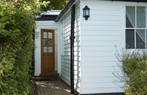Wittersham Cottage | A charming, detached, weather-boarded cottage, set in a secluded location on the edge of the histori