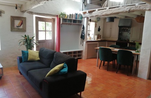 Bouin Cottage | a charming little house deep in a fenced garden with stone walls