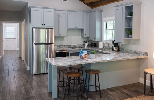 Livingston Cabin | A Cozy ADA Accessible Getaway Right on the Water, Two Creeks Crossing Resort