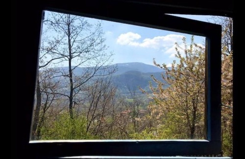 Villa Minozzo Cabin | A cute colourful Glamping cabin with a bohemian theme.