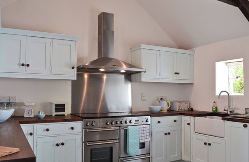 New Quay Cottage | A detached character cottage with beams, wood burner and enclosed garden.