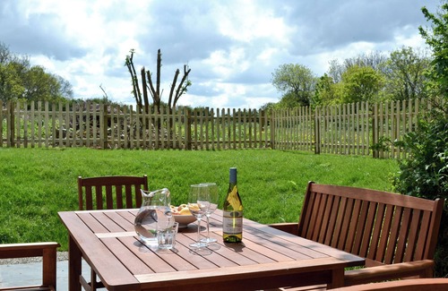 New Quay Cottage | A detached character cottage with beams, wood burner and enclosed garden.