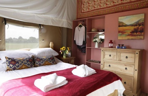 Exton Cottage | A home from home canvas-wrapped three bedroom colonial style tent. Within 500 hectares of parkland.