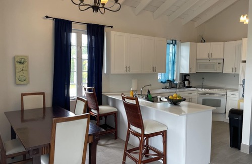 Long Bay Hills Cottage | A Kiteboarders Dream complete with a Pickle Ball Court and a Pool!