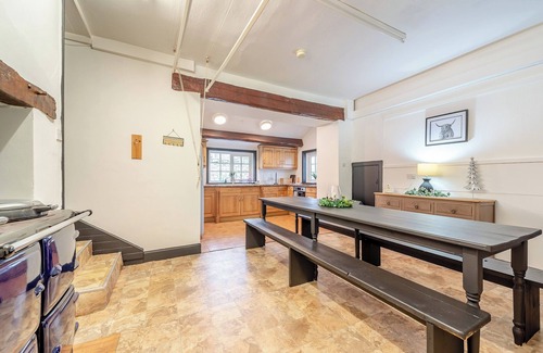 Newton Stewart Cottage | A large, detached farmhouse with open views of the countryside.