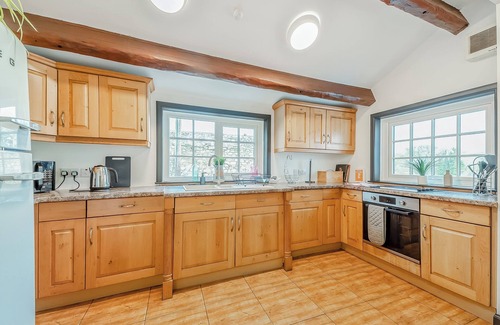 Newton Stewart Cottage | A large, detached farmhouse with open views of the countryside.