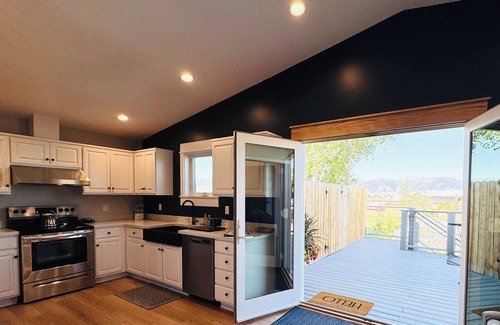 Bozeman Apartment | A large sundeck, 2 bedrooms, 1 sofa bed, a stocked kitchen and a full bathroom.