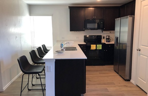 Princeton Condo | A master bedroom suite with its own bathroom and kitchen