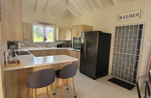 Eden Lodge House | A modern and spacious house, steps to the beach with a private pool!