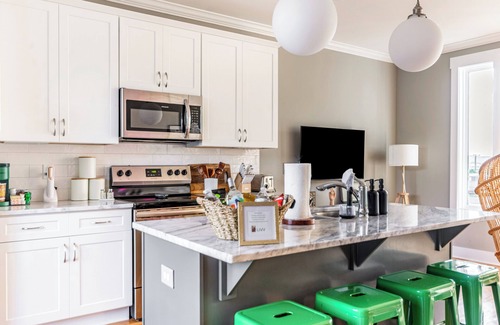 Katie Hill Neighborhood House | A modern two-bedroom/2.5 Bathroom townhome in East Nashville. Come enjoy this amazing rooftop! Our home includes a spacious garage for two vehicles. This newly built home is only a 10-min drive to most attractions including Broadway, Nissan Stadium,