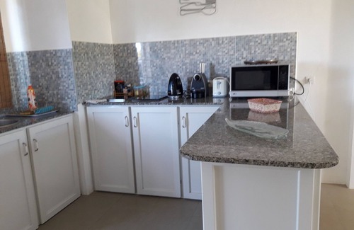 Pointe aux Biches Apartment | A person is available 24 hours a day to welcome travelers.