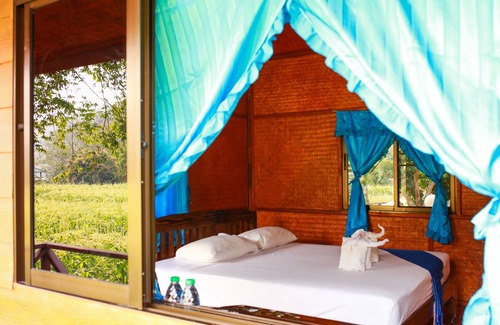 Mae Wang Cabin | a room with rice fields view