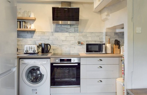 Muker Cottage | A south facing cottage situated in an elevated position within the traditional Yorkshire Dales villa