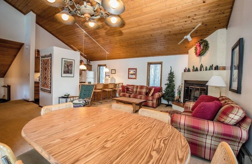 Bessemer House | A Spacious Vacation Home in a Wooded Setting With A Brick Fireplace
