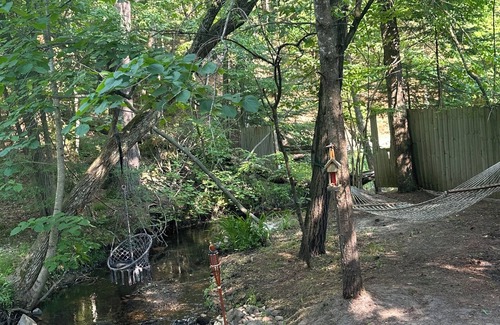 Mio Cabin | A Stream runs through it. Comfy little cabin with a stream by your bedroom.