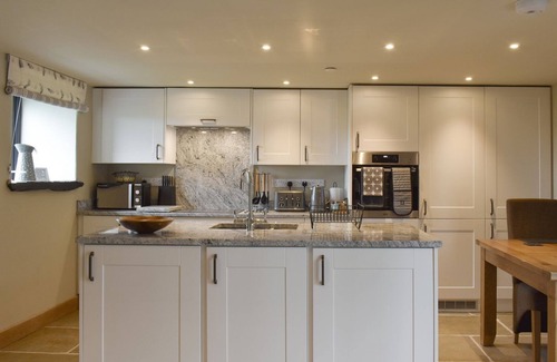 Corwen Cottage | A stunning barn conversion with hot tub, great views and a very comfy kingsize bed.