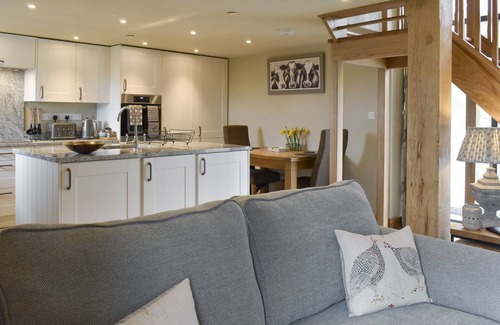 Corwen Cottage | A stunning barn conversion with hot tub, great views and a very comfy kingsize bed.