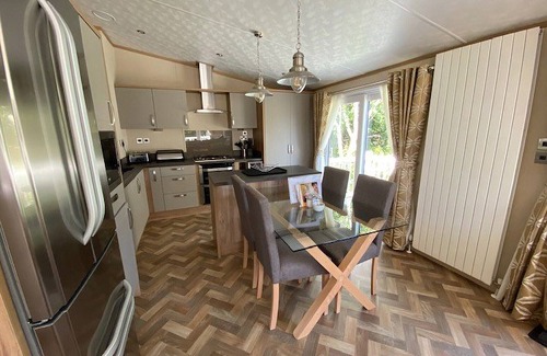 Langham House | A stunning lodge with one master double with en suite shower room.