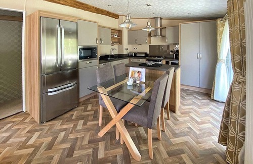 Langham House | A stunning lodge with one master double with en suite shower room.