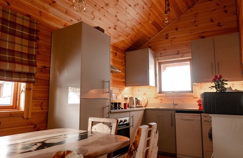 Gorebridge Cabin | A traditional Scandinavian style lodge, with stylish wooden interior decorated with a Scottish theme