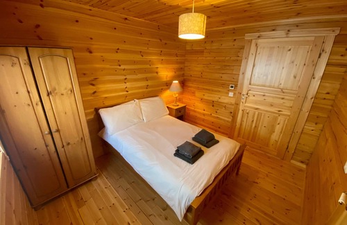 Gorebridge Cabin | A traditional Scandinavian style lodge, with stylish wooden interior decorated with a Scottish theme