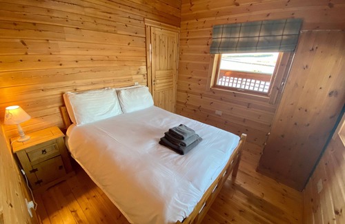 Gorebridge Cabin | A traditional Scandinavian style lodge, with stylish wooden interior decorated with a Scottish theme