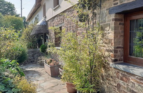 Rosevine Cottage | A traditional semi detached thatch cottage sleeping four guests and located in a North Devon valley