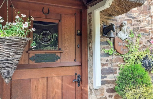 Rosevine Cottage | A traditional semi detached thatch cottage sleeping four guests and located in a North Devon valley