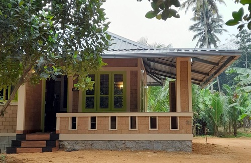 Nedumangad Cottage | A tranquil, riverside earthen home for a comfortable and peaceful stay