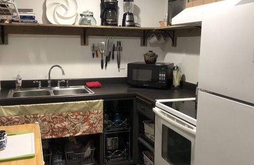 Veneta Apartment | A waterfall, bountiful gardens and the sound of birds, fenced and pet friendly!