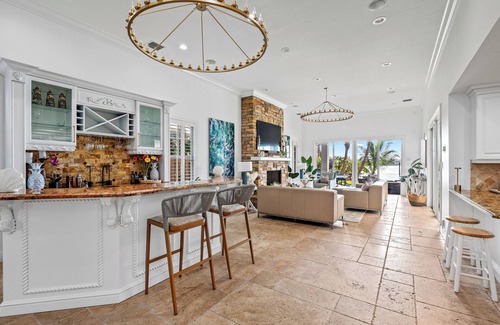 Boynton Beach Villa | A waterfront oasis with soft white sand beach, pool and intracoastal dock views.