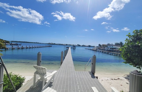 Boynton Beach Villa | A waterfront oasis with soft white sand beach, pool and intracoastal dock views.