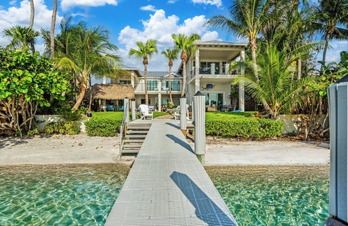 Boynton Beach Villa | A waterfront oasis with soft white sand beach, pool and intracoastal dock views.