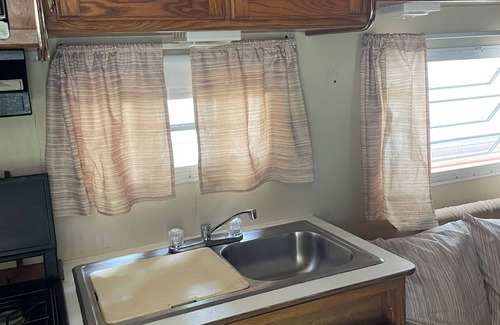 Grayling House | A well-maintained, vintage camper in a secluded location near state land