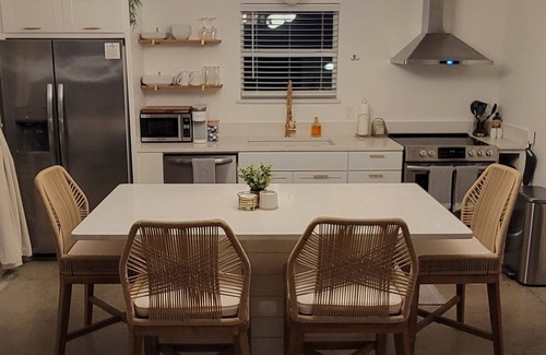 Medicine Park Cottage | Acorn Cottage: bright luxury boho home with large outdoor fenced patio area!
