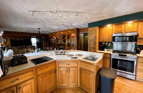 Old Forge House | ADK Channel House - Spacious, waterfront home. Huge boathouse with top sun deck