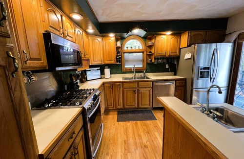 Old Forge House | ADK Channel House - Spacious, waterfront home. Huge boathouse with top sun deck