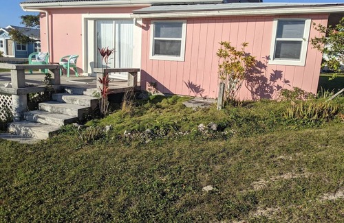 Green Turtle Cay Cottage | Adorable Pink cottage-OCEAN FRONT on Coco Bay with a dock. JULY AVAILABILITY!
