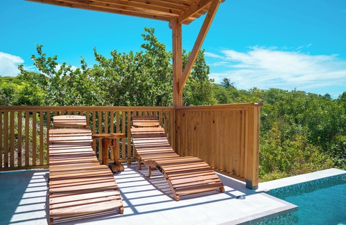 Saint George Parish Cottage | Affordable luxury, with runway views and tropical breeze.