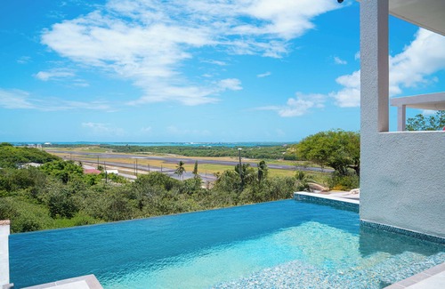 Saint George Parish Cottage | Affordable luxury, with runway views and tropical breeze.